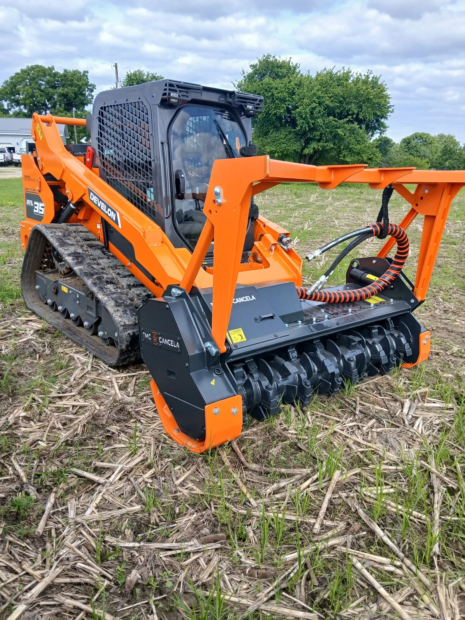 Stumpt LLC Develon DTL35 compact track loader with forestry mulcher head